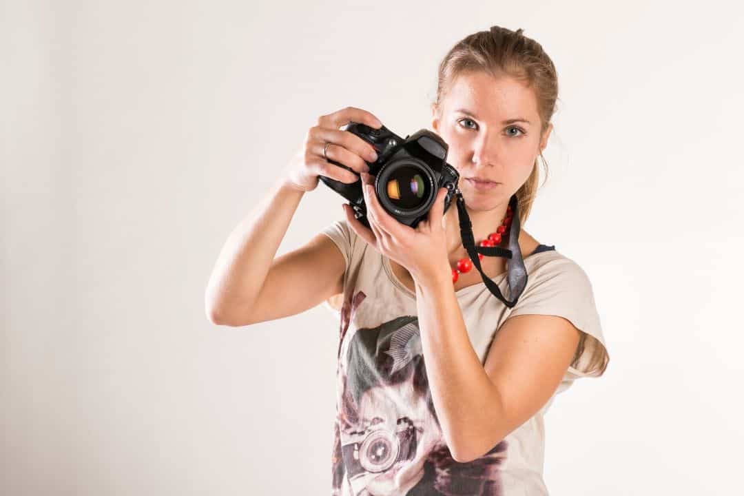photographer holding a nikon camera