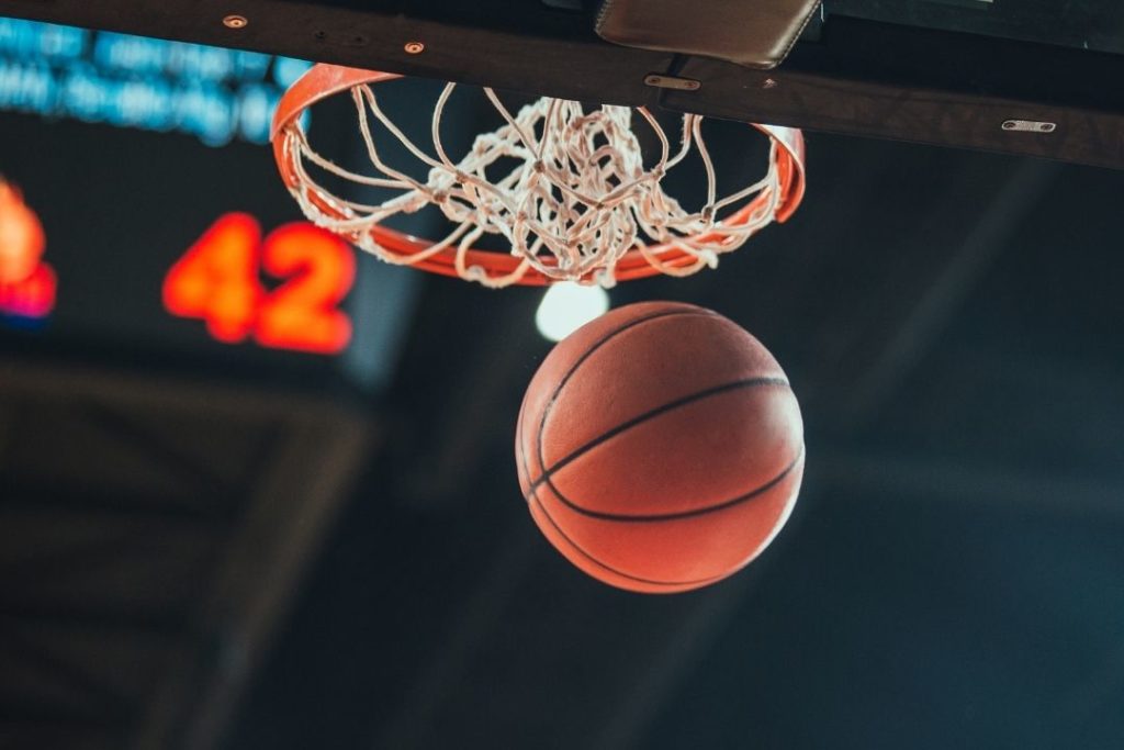 basketball entering a hoop