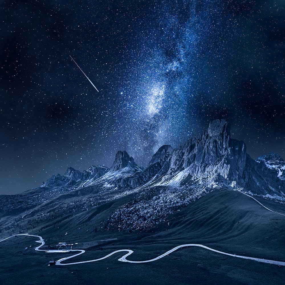 Milky way over Passo Giau. Aerial view of Dolomites at night, Italy