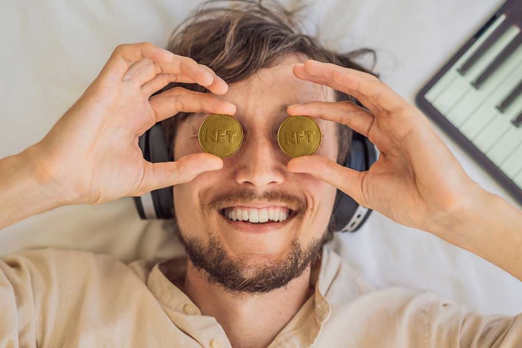 man with nft coin on his face