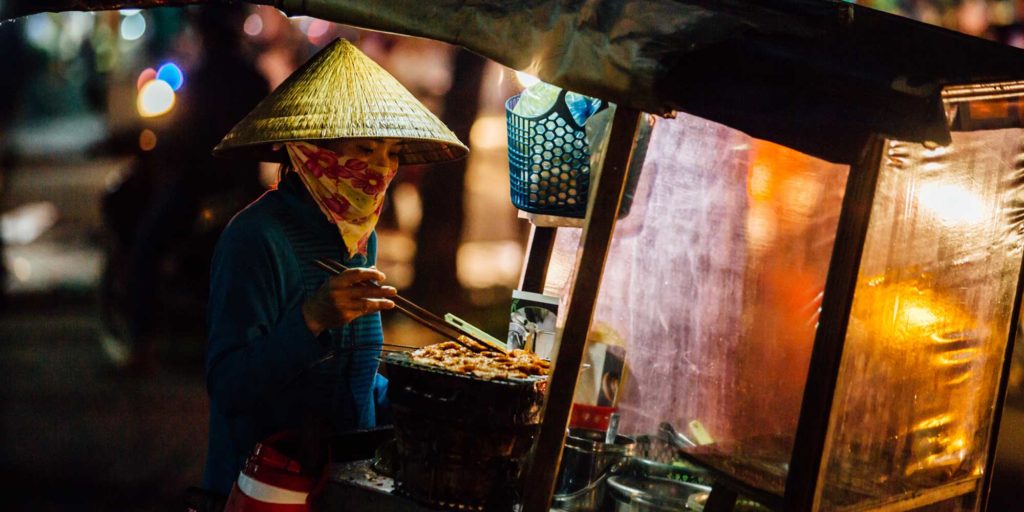 candid photograph of a street food vendor